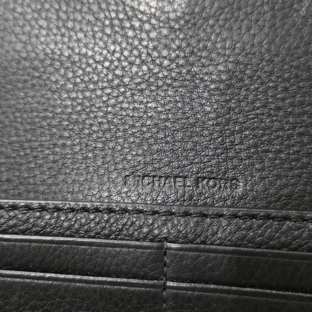 Michael Kors Fulton Large Flap Continental Wallet in black pebbled leather